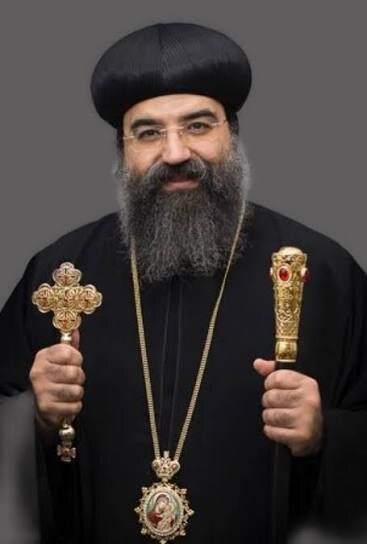 Portrait of His Grace Bishop Karas holding a cross and pastoral staff