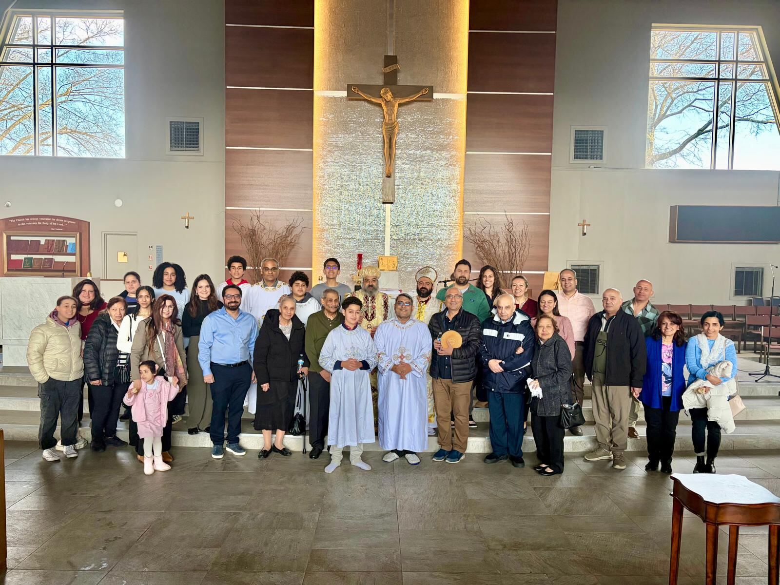Church community gathered together in front of the altar