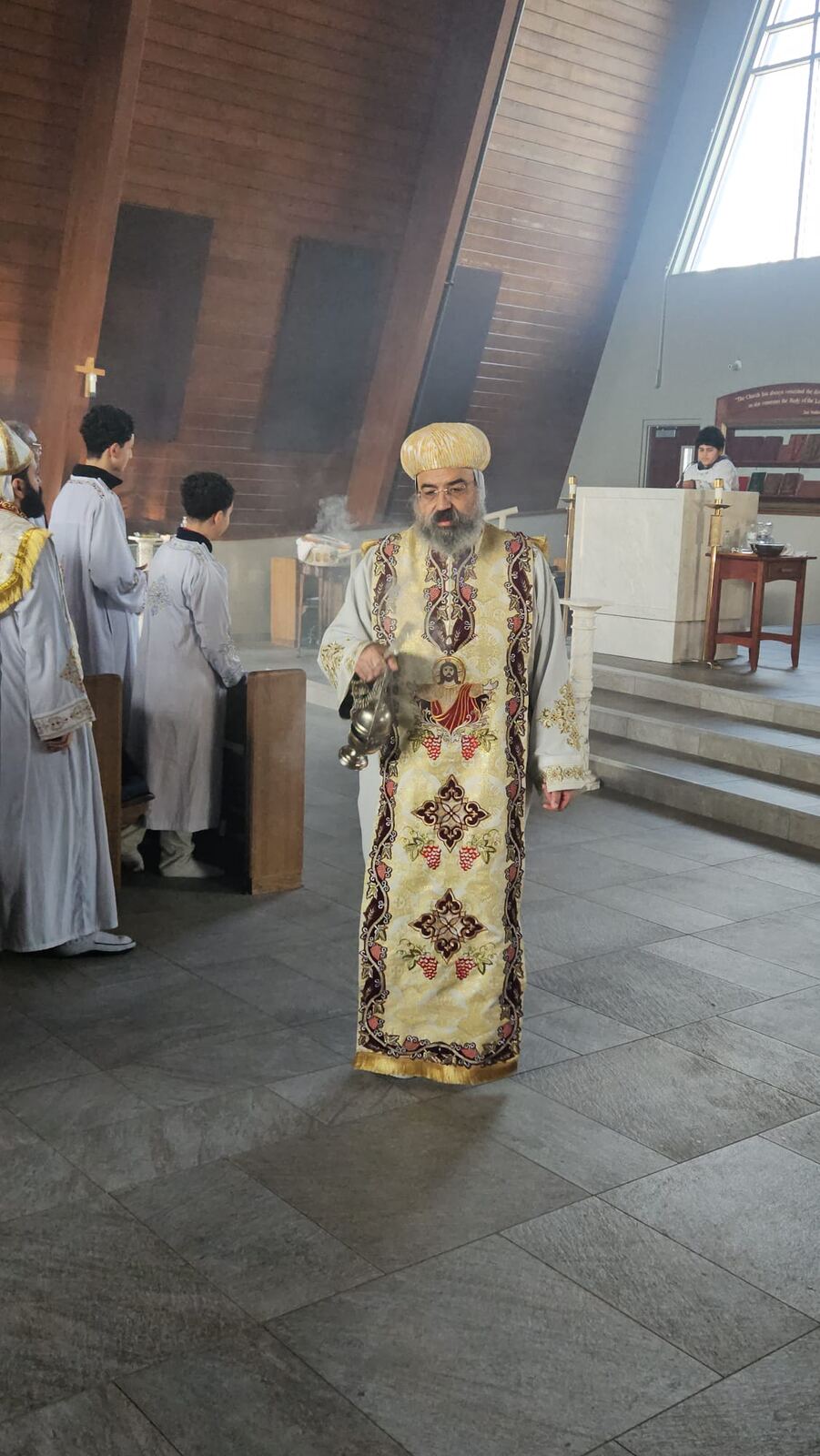 Priest offering incense in the church